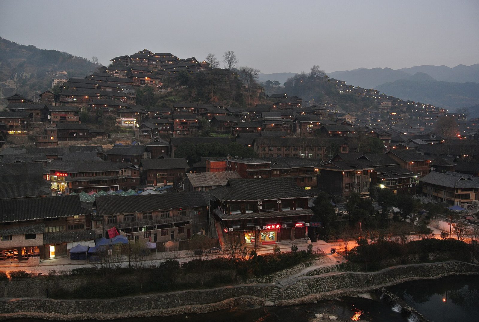 A Miao village in the Guizhou hills at dusk