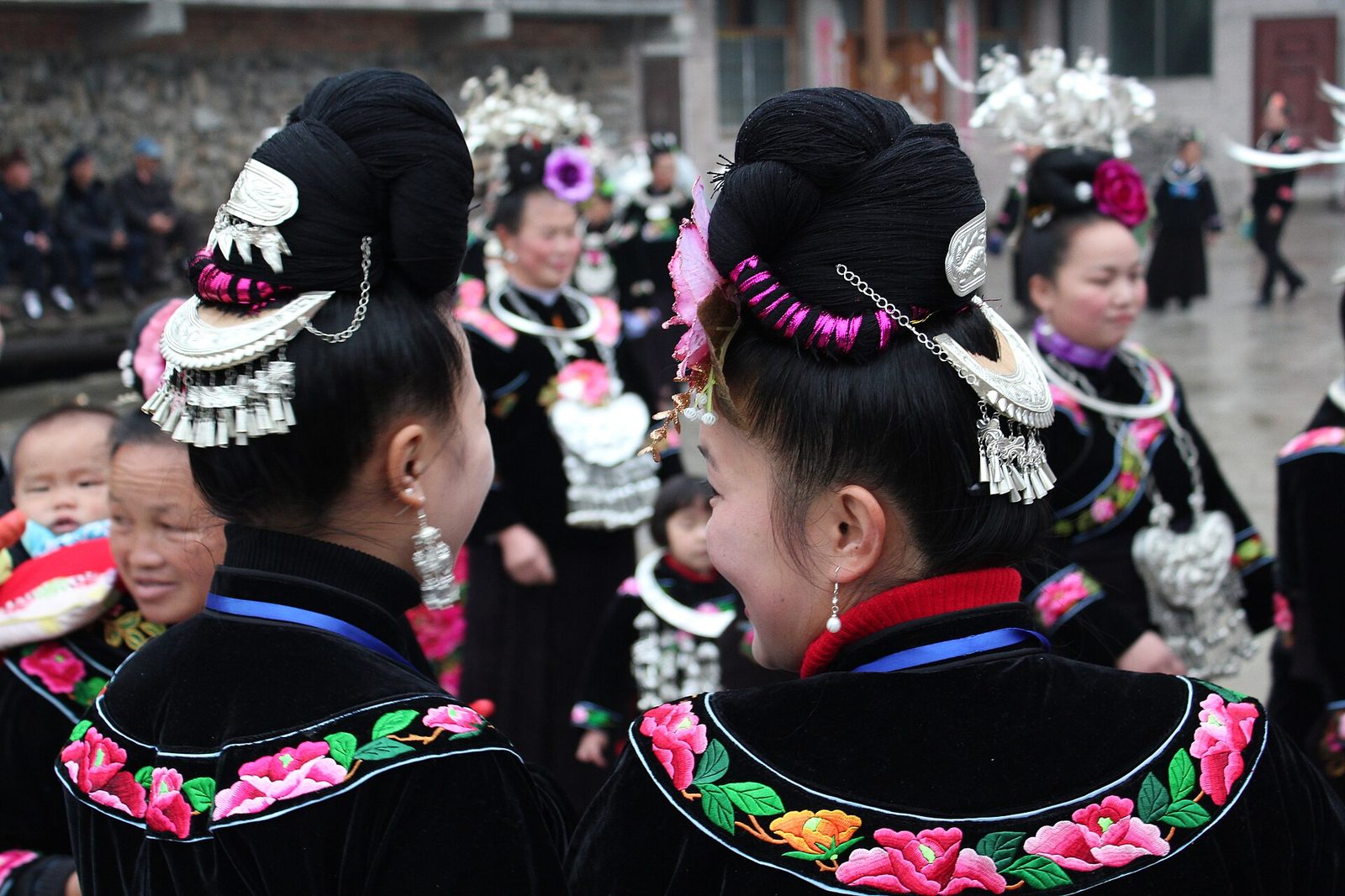 Miao women in festival silver, Guizhou